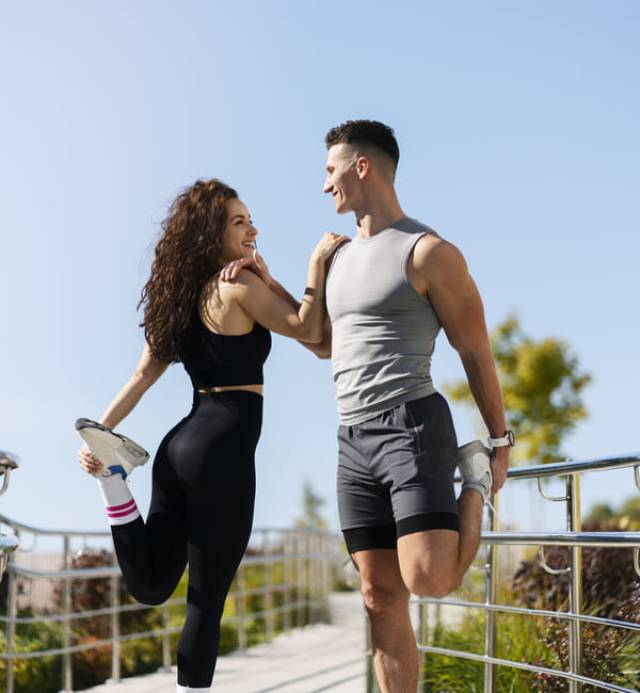 couple-stretching-outdoors-before-morning-run-2024-10-18-08-33-09-utc (1)