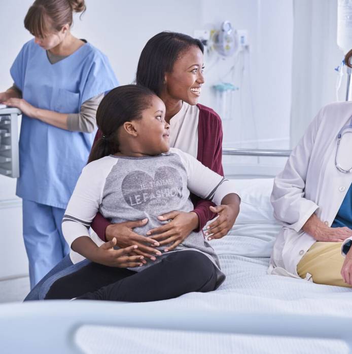 girl-patient-and-her-mother-talking-to-female-doct-2025-04-03-21-31-51-utc