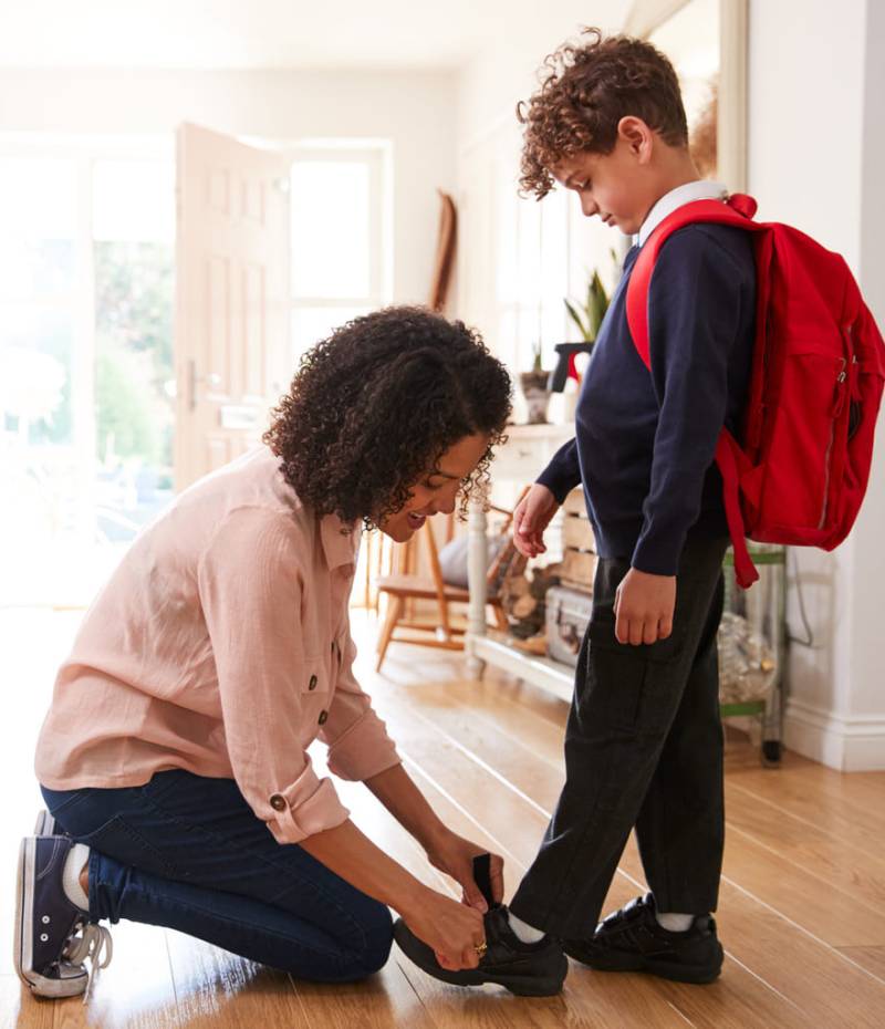 single-mother-at-home-getting-son-wearing-uniform-2024-10-19-08-18-48-utc (1)